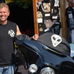 I'm standing next to my bike with a custom cover built by Shady Products out of Denver, Colorado.